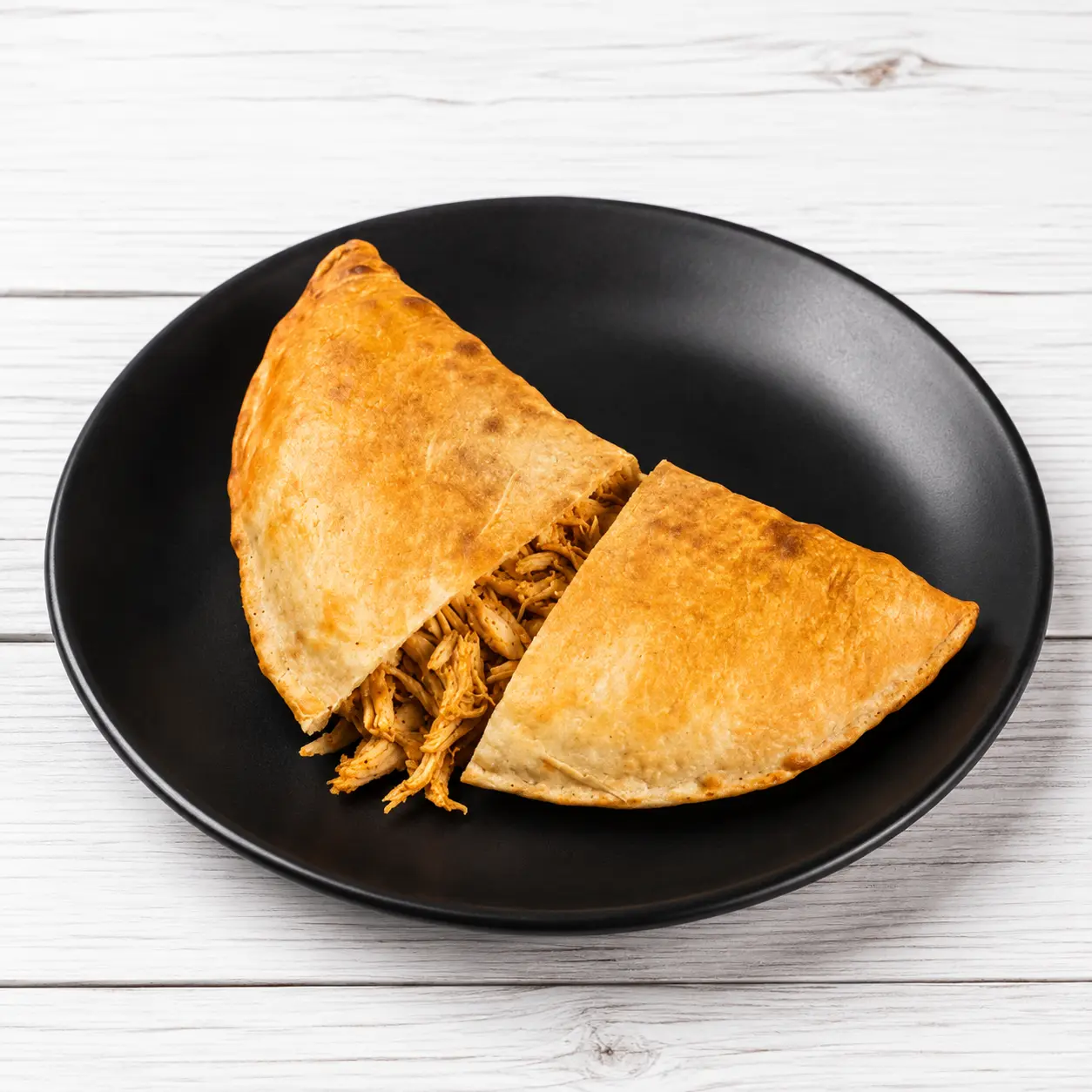 Chicken Calzone with coleslaw and in-house sauce from Calzone Express on Shawinigan Drive SW, Calgary, AB