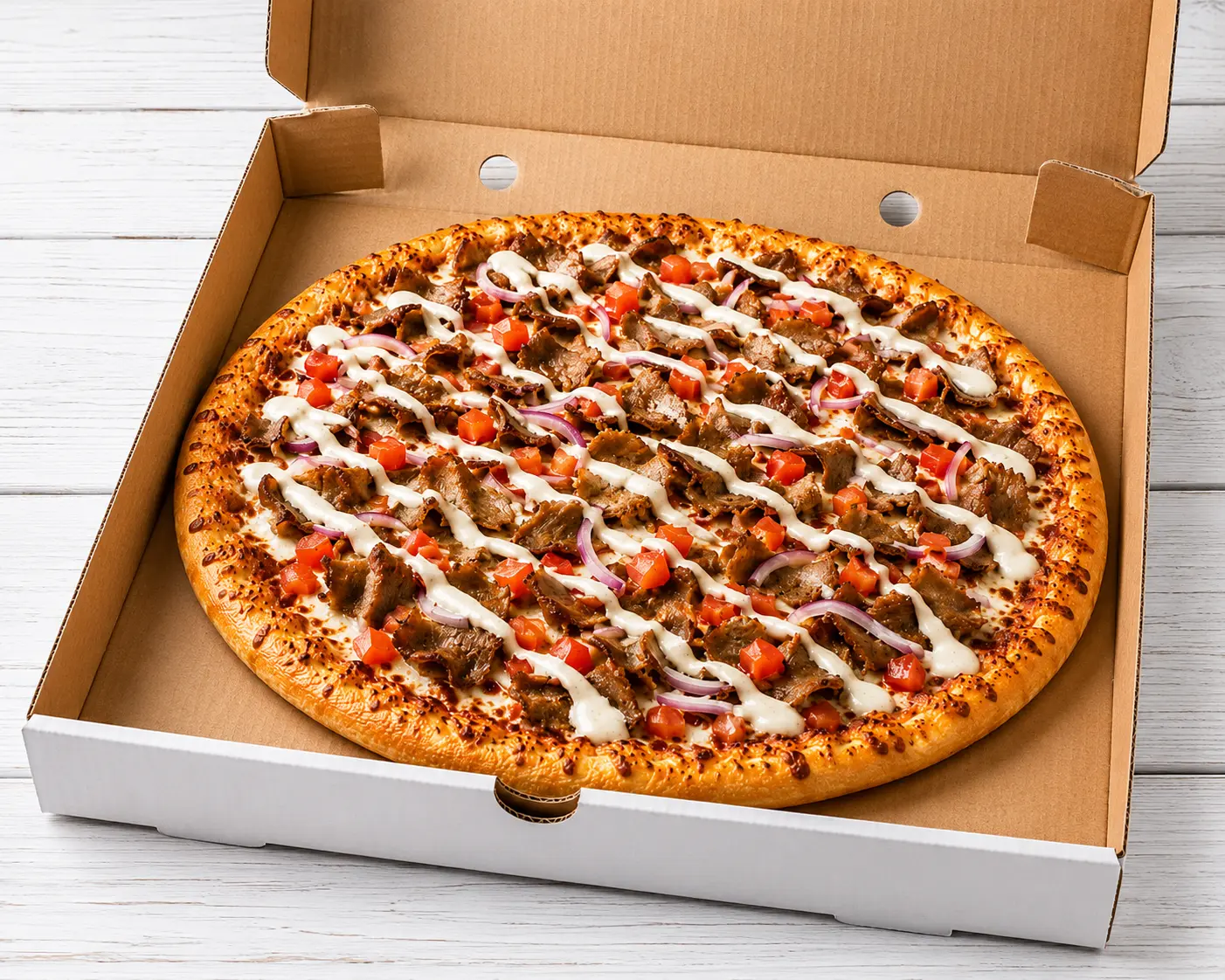 Donair Pizza with donair meat, red onion, tomato and sweet sauce at Calzone Express in Calgary SW, AB