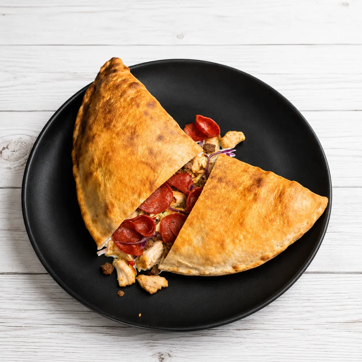 Meat Lovers Calzone with chicken, beef, pepperoni and coleslaw at Calzone Express in Calgary, AB